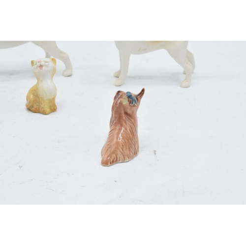 166 - A collection of Beswick to include matte fox hounds 2262 and 2263 together with Yorkshire Terrier La... 