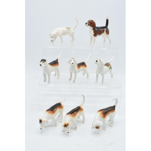 173 - A collection of Beswick hunting-themed animals to include Beagle Wendover Billy together with Foxhou... 