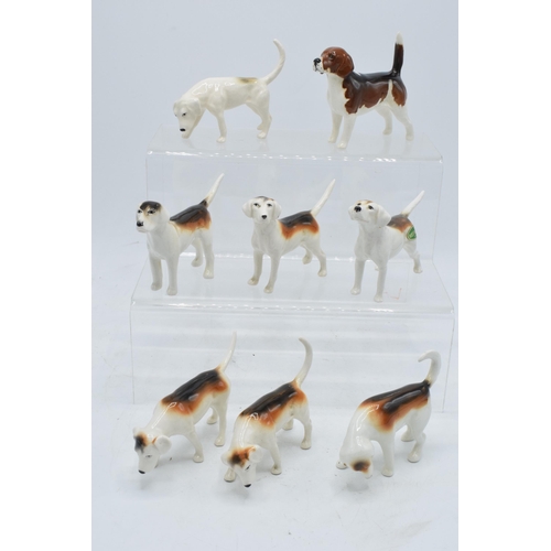 173 - A collection of Beswick hunting-themed animals to include Beagle Wendover Billy together with Foxhou... 