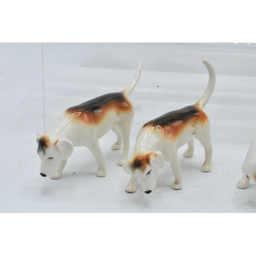 173 - A collection of Beswick hunting-themed animals to include Beagle Wendover Billy together with Foxhou... 