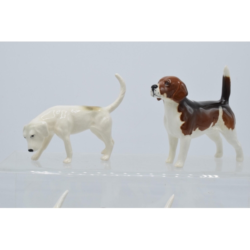 173 - A collection of Beswick hunting-themed animals to include Beagle Wendover Billy together with Foxhou... 