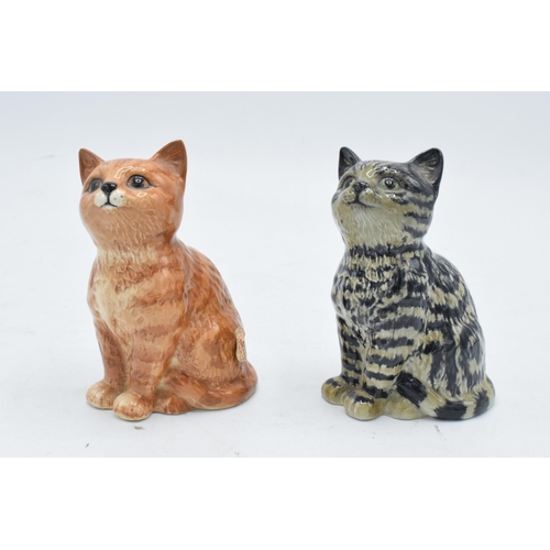 174 - A pair of Beswick Persian Kittens 1886 to include a grey swiss roll example together with a ginger s... 