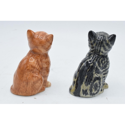 174 - A pair of Beswick Persian Kittens 1886 to include a grey swiss roll example together with a ginger s... 