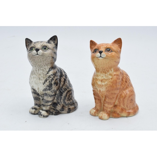 176 - A pair of Beswick Persian Kittens 1886 to include a grey swiss roll example together with a ginger s... 