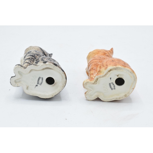 176 - A pair of Beswick Persian Kittens 1886 to include a grey swiss roll example together with a ginger s... 