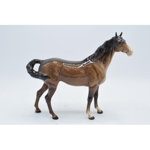 181A - Beswick early brown Swishtail horse 1182 with 2 holes to underside of belly. In good condition with ... 