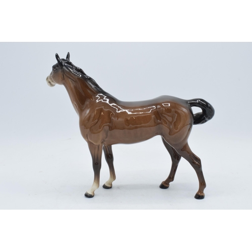 181A - Beswick early brown Swishtail horse 1182 with 2 holes to underside of belly. In good condition with ... 