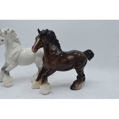 183 - Beswick Cantering Shires 975 to include a brown and a grey example (2). In good condition with no ob... 