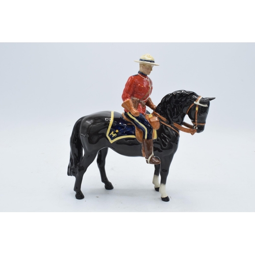 184A - Beswick Canadian Mountie 1375. 21cm tall. In good condition generally though restoration is apparent... 