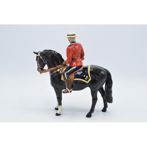 184A - Beswick Canadian Mountie 1375. 21cm tall. In good condition generally though restoration is apparent... 