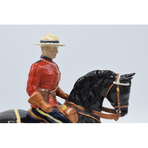 184A - Beswick Canadian Mountie 1375. 21cm tall. In good condition generally though restoration is apparent... 