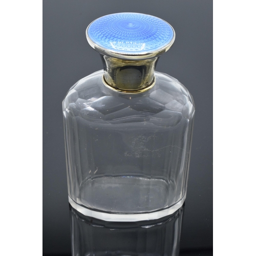 206 - Silver glass scent bottle with a blue enamelled lid. Birmingham 1928. In good condition. Minor loss ... 