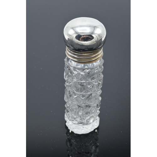 209 - Victorian glass scent bottle with silver screw top lid. Birmingham 1901. 8cm tall. In good condition... 