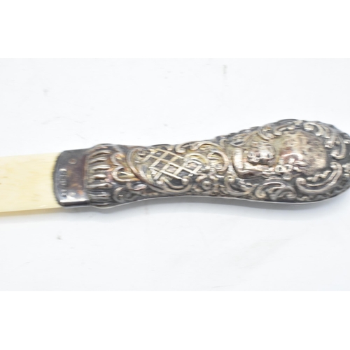 212 - Silver handled page turner. Birmingham 1902. 26cm long.