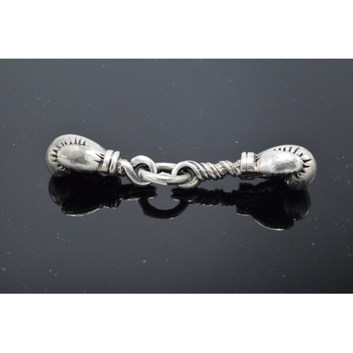 216 - An unusual pair of silver charms in the form of boxing gloves. 19.0 grams.