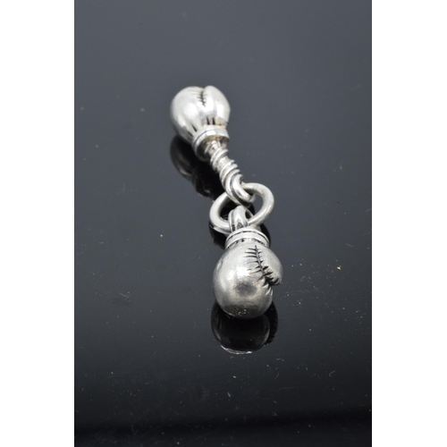 216 - An unusual pair of silver charms in the form of boxing gloves. 19.0 grams.