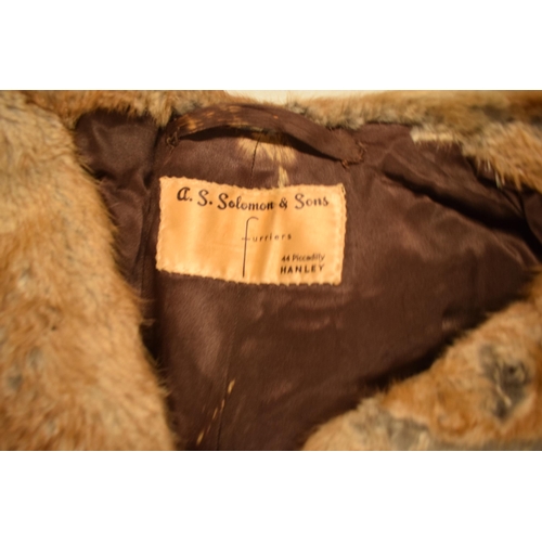 228 - A large collection of fur coats of varying lengths and similar items by various makers such as Solom... 