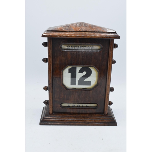 236 - An early 20th century wooden perpetual calendar with separate scrolls for the day of the week, numbe... 