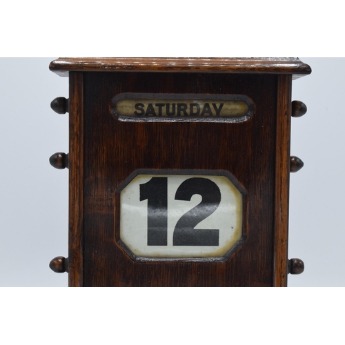 236 - An early 20th century wooden perpetual calendar with separate scrolls for the day of the week, numbe... 