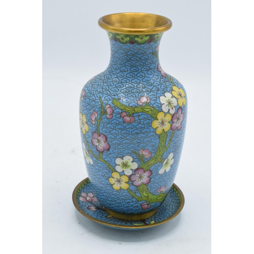 247A - A 20th century Japanese cloisonné vase and matching stand decorated with a floral design on a blue b... 