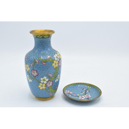 247A - A 20th century Japanese cloisonné vase and matching stand decorated with a floral design on a blue b... 