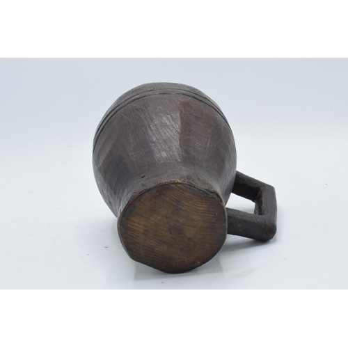 258 - An unusual late 19th / early 20th carved oak wooden tankard, folk art interest, in the Black Forest ... 