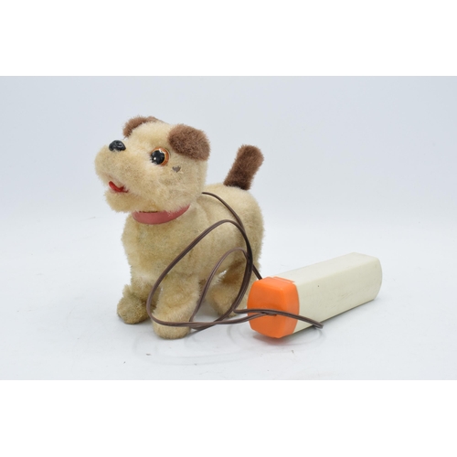 273 - A mid to late 20th century toy in the form of a remote controlled dog, battery operated, made by Iwa... 