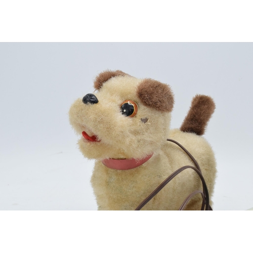 273 - A mid to late 20th century toy in the form of a remote controlled dog, battery operated, made by Iwa... 