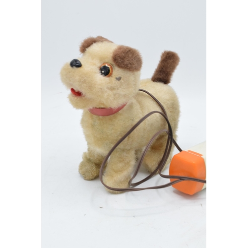 273 - A mid to late 20th century toy in the form of a remote controlled dog, battery operated, made by Iwa... 