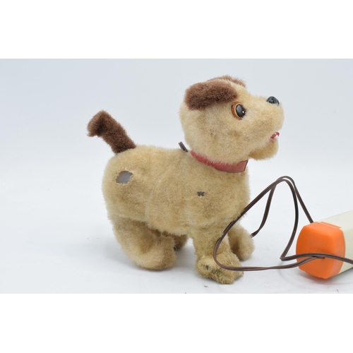 273 - A mid to late 20th century toy in the form of a remote controlled dog, battery operated, made by Iwa... 