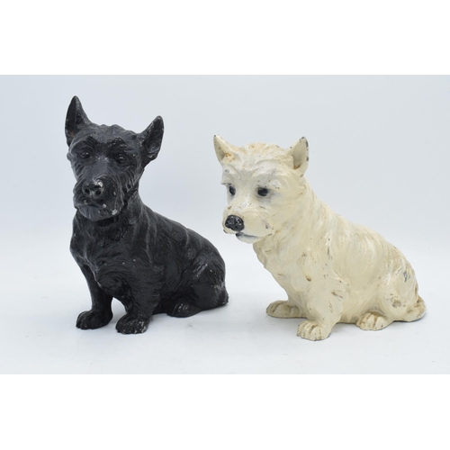 275 - A pair of painted cast metal dogs perhaps advertising Whyte and Mackay Whiskey. In good condition wi... 