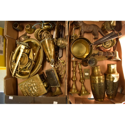 283 - A good collection of brass and metalware to include nut crackers, vases, saucepans, trivet, boxes, t... 