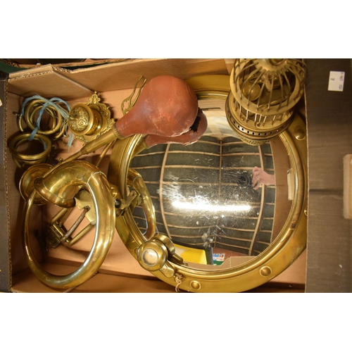 284 - A good collection of brass and metalware to include a porthole style mirror, bird cage, vases, small... 