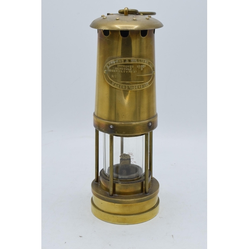 293 - E Thomas and Williams Ltd brass miners lamp. 25cm tall.