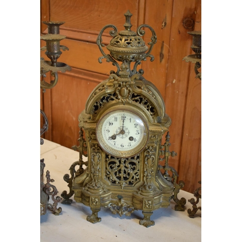 294 - Late 19th / early 20th century gilt brass clock and matching 5 sconce garnitures (3) in a gothic / o... 