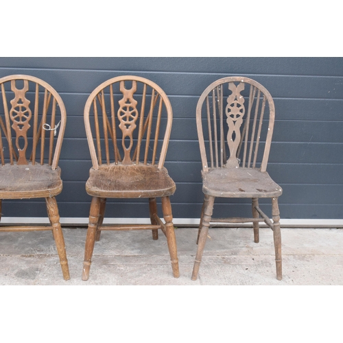 300 - A set of matching farmhouse spindle back chairs x 3 together with a matched example (4). Approx 89cm... 