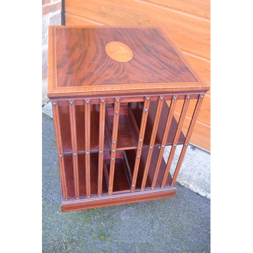 301 - Edwardian mahogany rotating bookcase with string inlay and a satinwood inlay motif. 63 x 63 x 92cm t... 