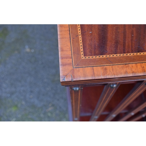 301 - Edwardian mahogany rotating bookcase with string inlay and a satinwood inlay motif. 63 x 63 x 92cm t... 