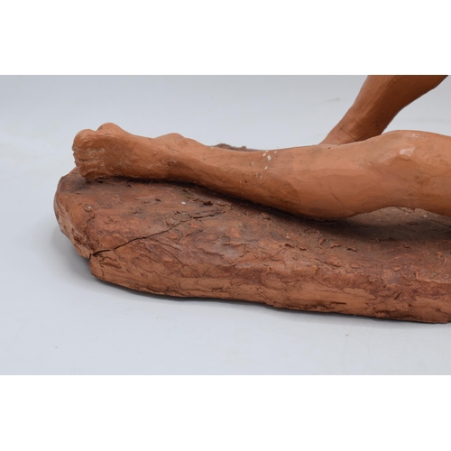 319 - Angela Munslow large clay figure of a naked lady lying down. 47cm long. In good condition with some ... 