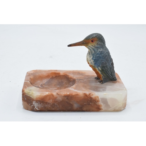 324 - A 20th century painted metal kingfisher mounted onto an alabaster or similar base in the form of a p... 