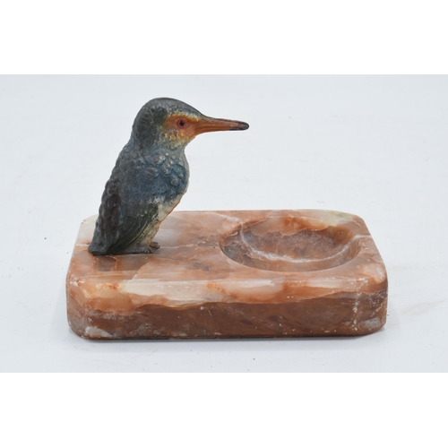 324 - A 20th century painted metal kingfisher mounted onto an alabaster or similar base in the form of a p... 