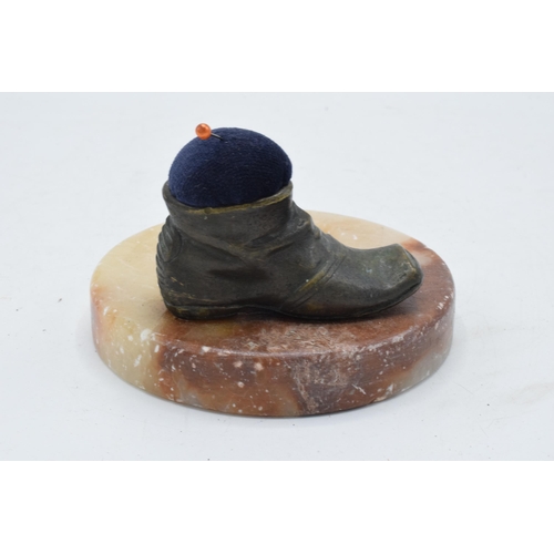 325 - A 20th century boot pin cushion mounted onto an alabaster or similar base in the form of a pin dish ... 