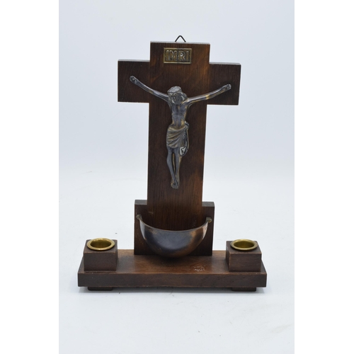 327 - A 20th century crucifix mounted onto a wooden stand flanked with candlestick holders with 'INRI' to ... 