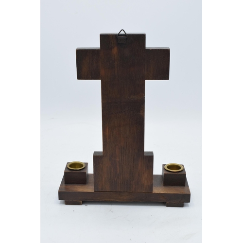 327 - A 20th century crucifix mounted onto a wooden stand flanked with candlestick holders with 'INRI' to ... 