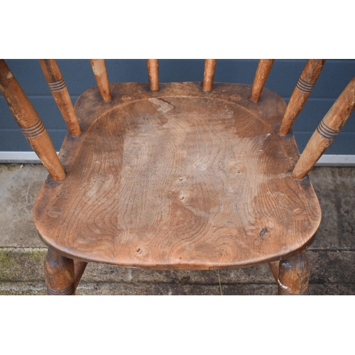 336 - A late 19th century elm or similar Captains bow back arm chair. 79cm tall. In good condition with si... 