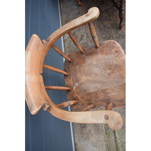 336 - A late 19th century elm or similar Captains bow back arm chair. 79cm tall. In good condition with si... 