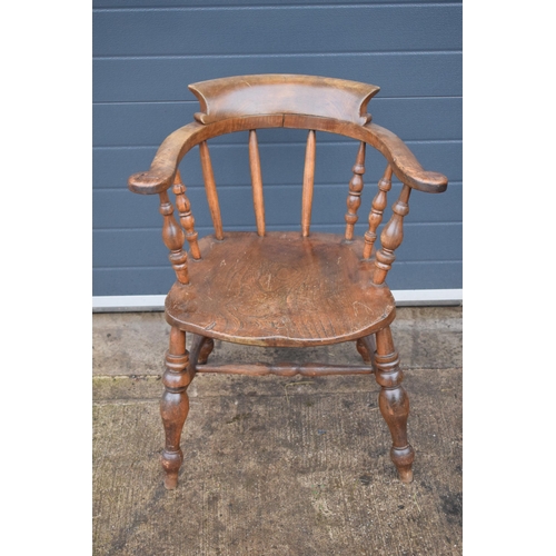 337 - A late 19th century elm or similar Captains bow back arm chair. 79cm tall. In good condition with si... 