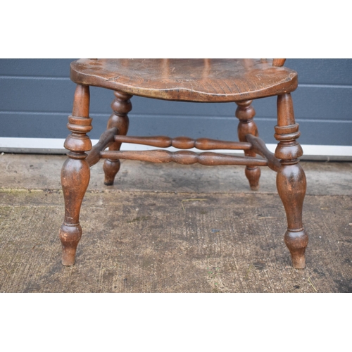 337 - A late 19th century elm or similar Captains bow back arm chair. 79cm tall. In good condition with si... 