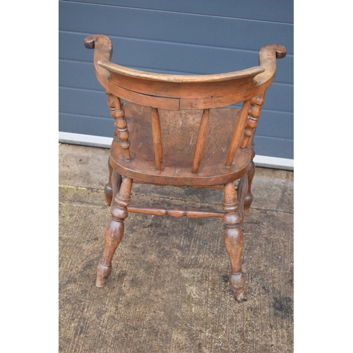 337 - A late 19th century elm or similar Captains bow back arm chair. 79cm tall. In good condition with si... 