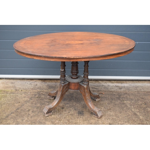 338 - A 19th century walnut tilt-top occasional table with quarter veneered top with inlay decoration on f... 